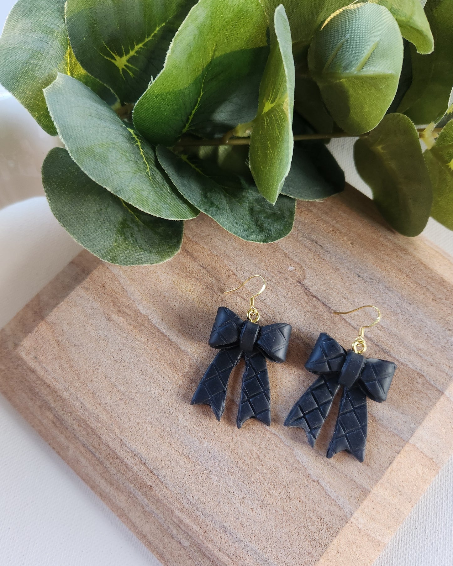 Clay bow dangle earrings